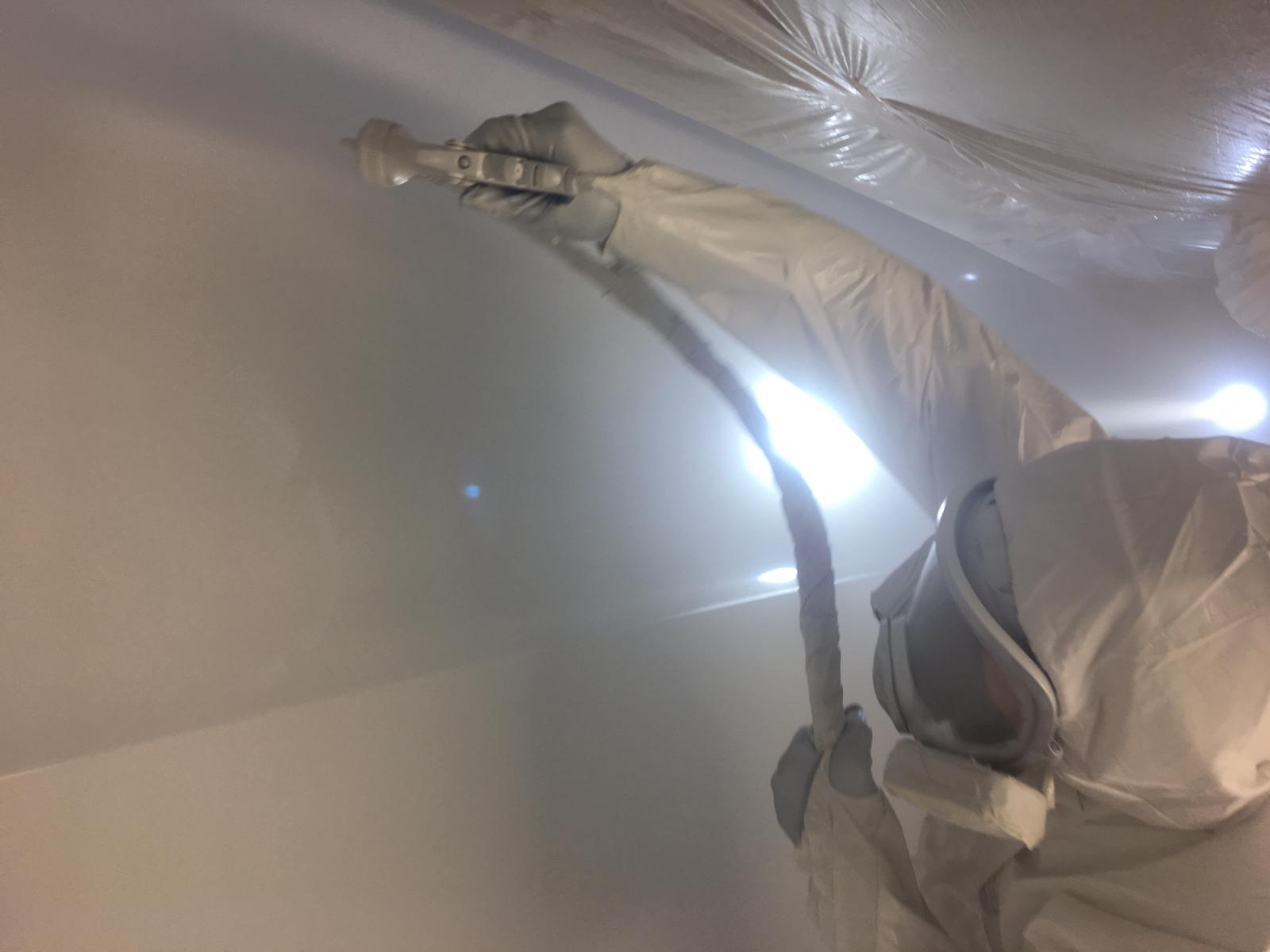 paint-technician-painting-luxury-yacht