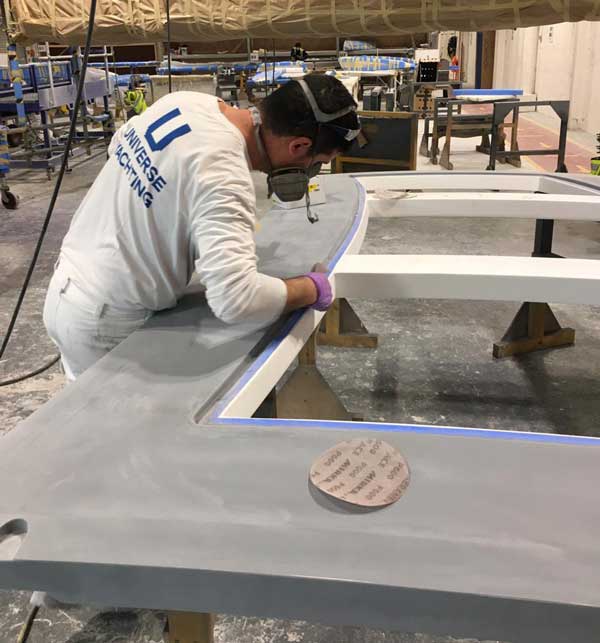 painter-polishing-yacht-component